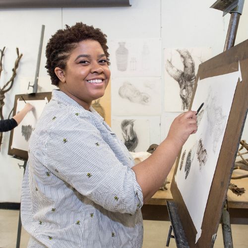 A student paints at the
Community College of Philadelphia