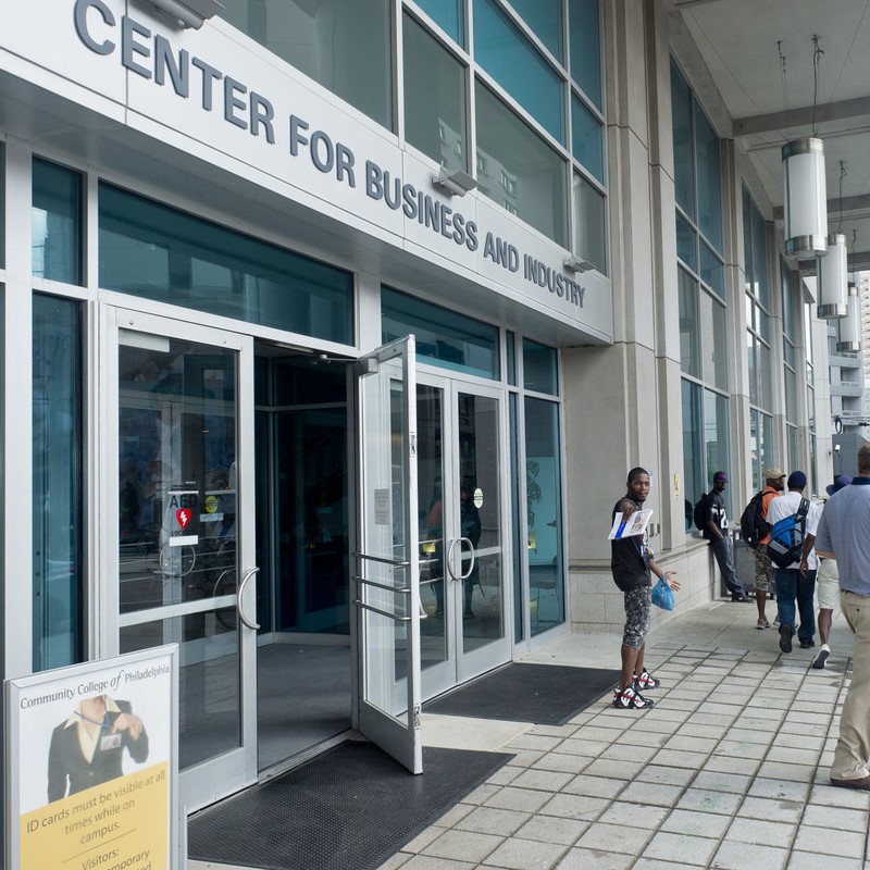 Students stand outside of the Center for Business and Industry on the Community College of Philadelphia campus