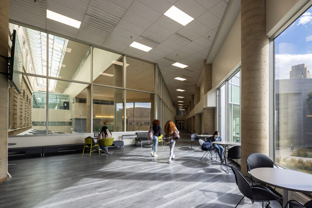 A sitting area with huge windows and natural lighting in the Community College of Philadelphia library